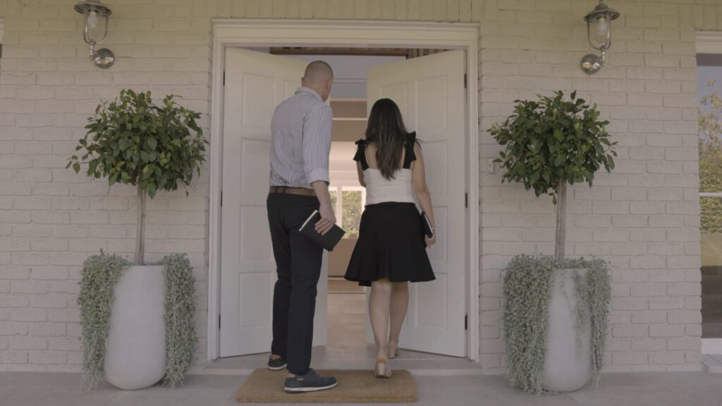 Dea and Mike Manassen arriving at a front door