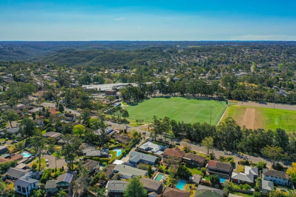 Aerial view of homes and playing fields in the Forest district on the Northern Beaches